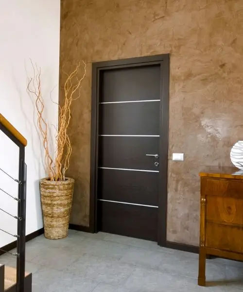 Contemporary dark flush internal door with metal inlays, a contemporary door of the kind we fit in flats and offices in Newcastle