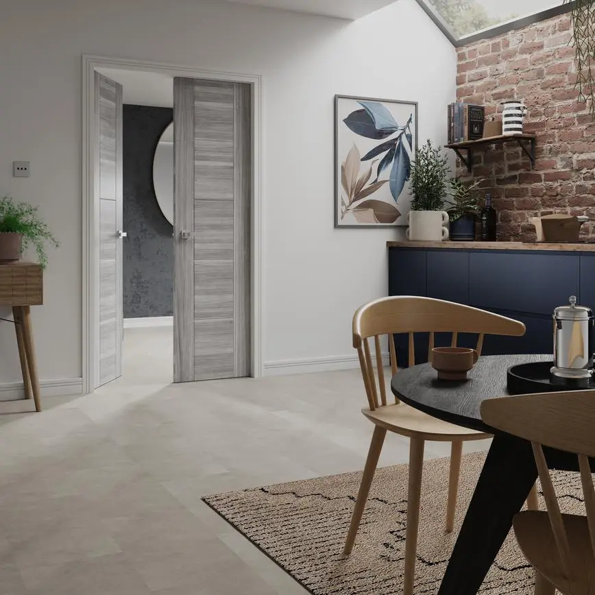 Grey oak-effect pocket doors opening from a dining room, a pocket door setup like the ones we fit in Gateshead